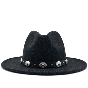 Detail of wool fedora hat featuring a black leather band with vintage silver studs