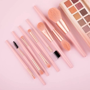 10-piece professional pink makeup brush set with rose gold accents on a soft background