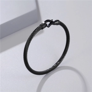 Men's black stainless steel twisted cable bangle featuring a horseshoe shackle clasp