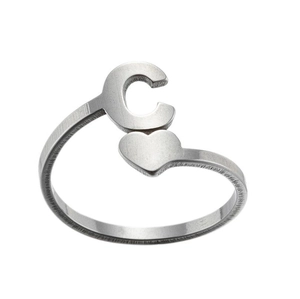 Detail of silver stainless steel open ring with letter C and heart design