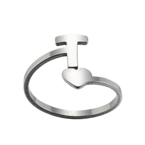 Detail of silver stainless steel open ring featuring a T-letter and heart motif