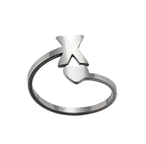 Detail of silver stainless steel open ring featuring letter X and heart design