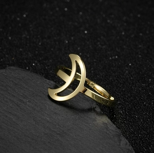 Minimalist gold moon star open ring in stainless steel for women on dark stone base