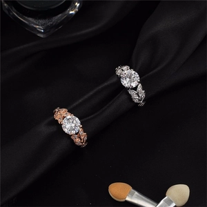 Elegant leaf-shaped engagement rings in rose gold and silver with zircon stones