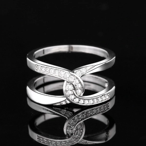 Silver double-layer interlocking ring with white cubic zirconia on black mirror reflection