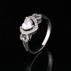 Fashionable silver heart zircon ring with sparkling pave setting on mirror reflection