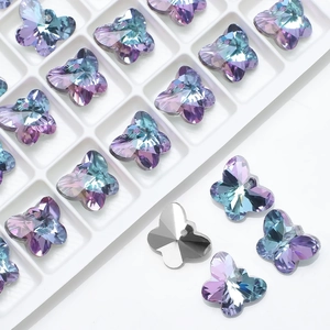 Close-up of 14mm butterfly crystal pendants in purple blue gradient with metal bases