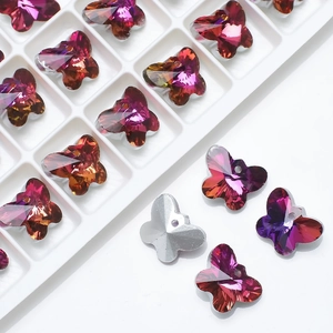 Macro detail of 14mm butterfly crystal pendants with purple gradient for DIY jewelry making