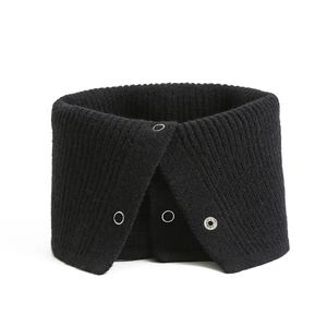 Detail of black ribbed knit neck warmer featuring adjustable metal snap button closures