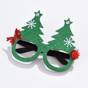 Detail of green glitter Christmas tree glasses with white snowflakes and red bow decoration