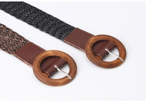 Detailed close-up of bohemian woven belts with round wooden buckles in black and brown