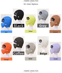 Flat lay display of thick knit aviator hats with goggles in ten assorted winter colors