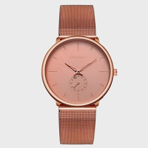 Minimalist rose gold watch with mesh band and large round dial for men and women