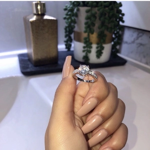Classic round zircon couple ring in silver setting with sparkling pavé diamond accents