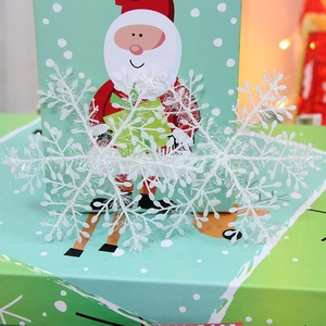 White glitter snowflake ornaments for Christmas tree and window holiday decorations