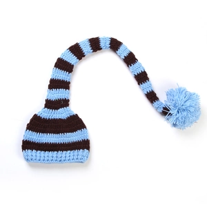 Hand-knitted baby Christmas hat with long tail and blue pompom in blue-brown stripes