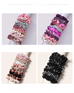 Detail showing 10-piece scrunchie sets in velvet, silk-like, and knit textures