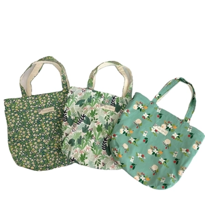 Three vintage floral cotton mini tote bags with various prints on a clean white backdrop
