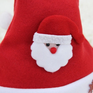 Classic red plush Christmas hat for kids featuring a 3D Santa Claus applique detail