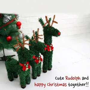 Three green glitter Christmas reindeer decorations with red bows in three sizes