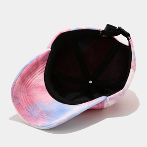 Pink and blue tie-dye baseball cap interior view showing black lining and plastic buckle