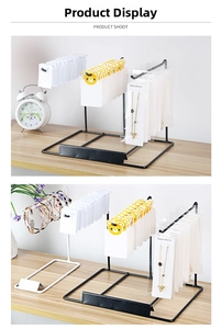 Detail showing white and black metal jewelry display racks for necklaces and accessories