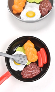 Detailed set of kids' toy frying pan with realistic food play props and spatula
