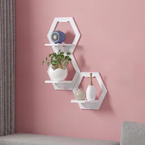Set of 3 white hexagonal floating wall shelves for modern bedroom and living room decor