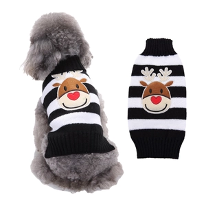 Detail of knitted dog sweater with black white stripes and brown reindeer embroidery