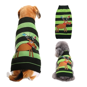 Detail view of a knitted pet sweater with festive green stripes and reindeer pattern