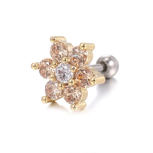Macro detail of gold-plated flower stud earring with champagne and clear zircon crystals