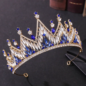 Detail of crystal wedding tiara with white and blue rhinestones on a golden base