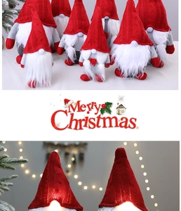 Glow-in-the-dark plush Christmas gnomes with red knitted hats for festive window displays