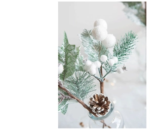 Close-up of frosted Christmas picks with pine cones and white berries for holiday decor
