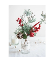 Close-up of festive Christmas branch with red berries, pine cones and artificial snow