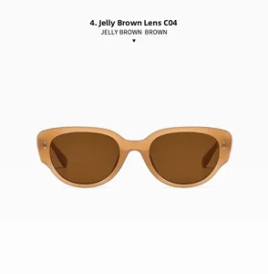 Close-up of stylish cat-eye sunglasses with jelly tea acetate frames and metal rivets