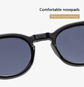 Close-up of ergonomic integrated nose pads on black oversized sunglasses for comfort