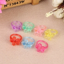 Set of seven colorful translucent resin flower rings in jelly colors for girls