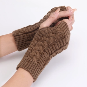 Detailed close-up of brown cable knit fingerless gloves showing texture and material