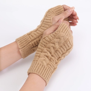 Close-up of camel cable knit fingerless gloves showing thick texture and wrist warmth