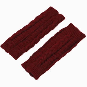 Detail of wine red cable-knit fingerless gloves showing high-quality yarn texture