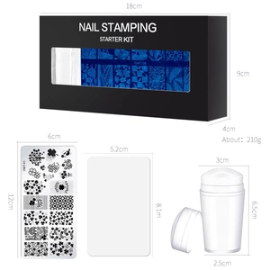 Complete nail stamping starter kit with steel plates, stamper, and scraper in a black box