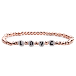 Rose gold 4mm copper bead LOVE bracelet for women on a clean white background