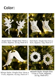 Detailed view of white glitter Christmas ornaments including angel owl wings and wreath