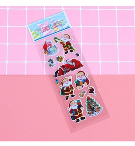 Close-up of cute 3D puffy Christmas stickers featuring Santa Claus and Xmas tree decor