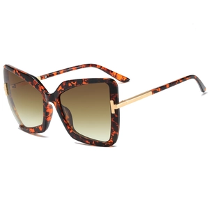 Butterfly frame sunglasses with tortoiseshell pattern and gold T-logo metal temples