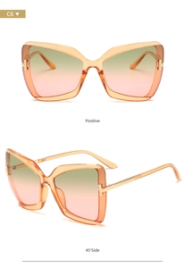 Detail of oversized butterfly sunglasses in orange gradient with T-shaped metal hinges