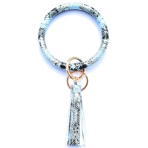 Detail of blue and white snakeskin pattern leather keychain bangle with tassel