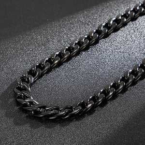 Macro shot of polished black titanium steel Cuban link necklace with metallic luster