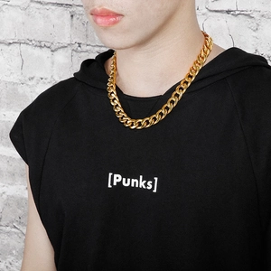 Detail of 18K gold plated titanium steel flat Cuban chain necklace worn by a male model